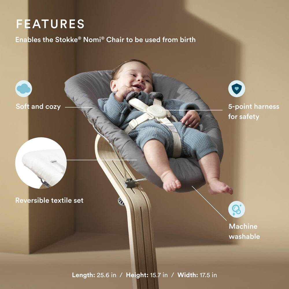 Stokke Nomi Newborn Set with 5-point harness keeps baby securely positioned.