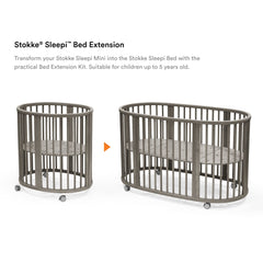 Stokke Sleepi Bed Extension V3 hazy grey in use, converting a mini crib to a full bed.