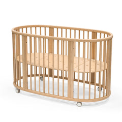 Stokke Sleepi Bed V3 natural oval nest design for infant comfort and family bonding.
