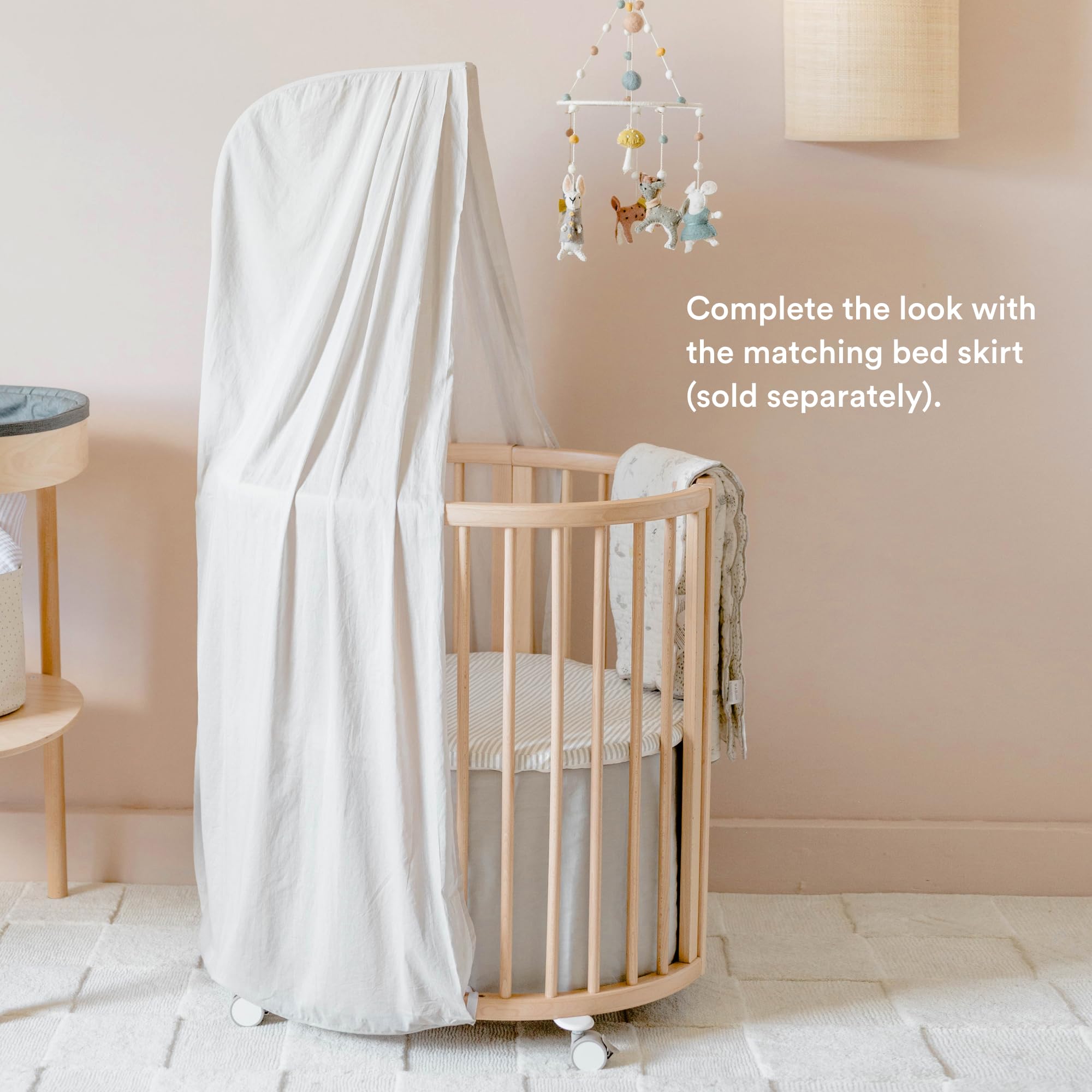 Stokke Sleepi Canopy in Grey coordinates with Pehr bed skirts for cohesive nurseries.