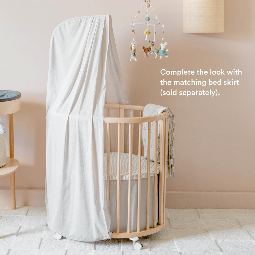 Stokke Sleepi Canopy in Grey coordinates with Pehr bed skirts for cohesive nurseries.