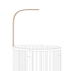 Stokke Sleepi Drape Rod Natural mounted on crib for soft nursery drapery.