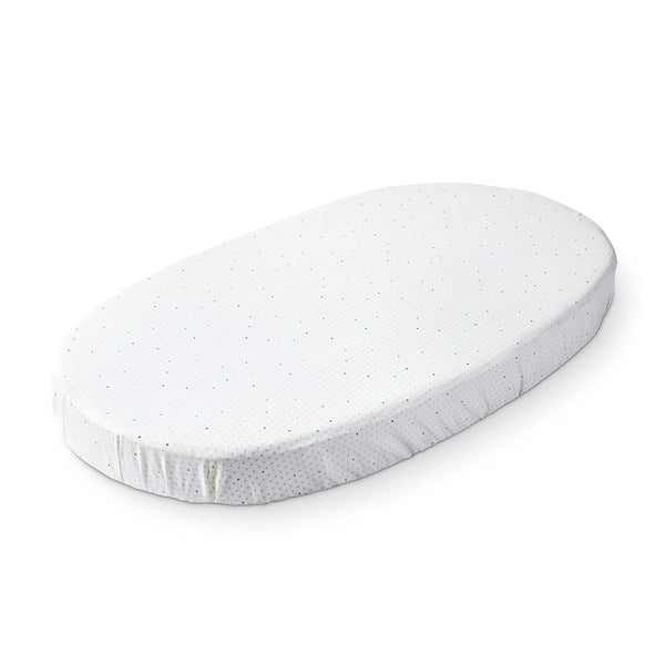 Stokke Sleepi fitted sheet rainbow dot close-up showing soft organic cotton for gentle sleep.