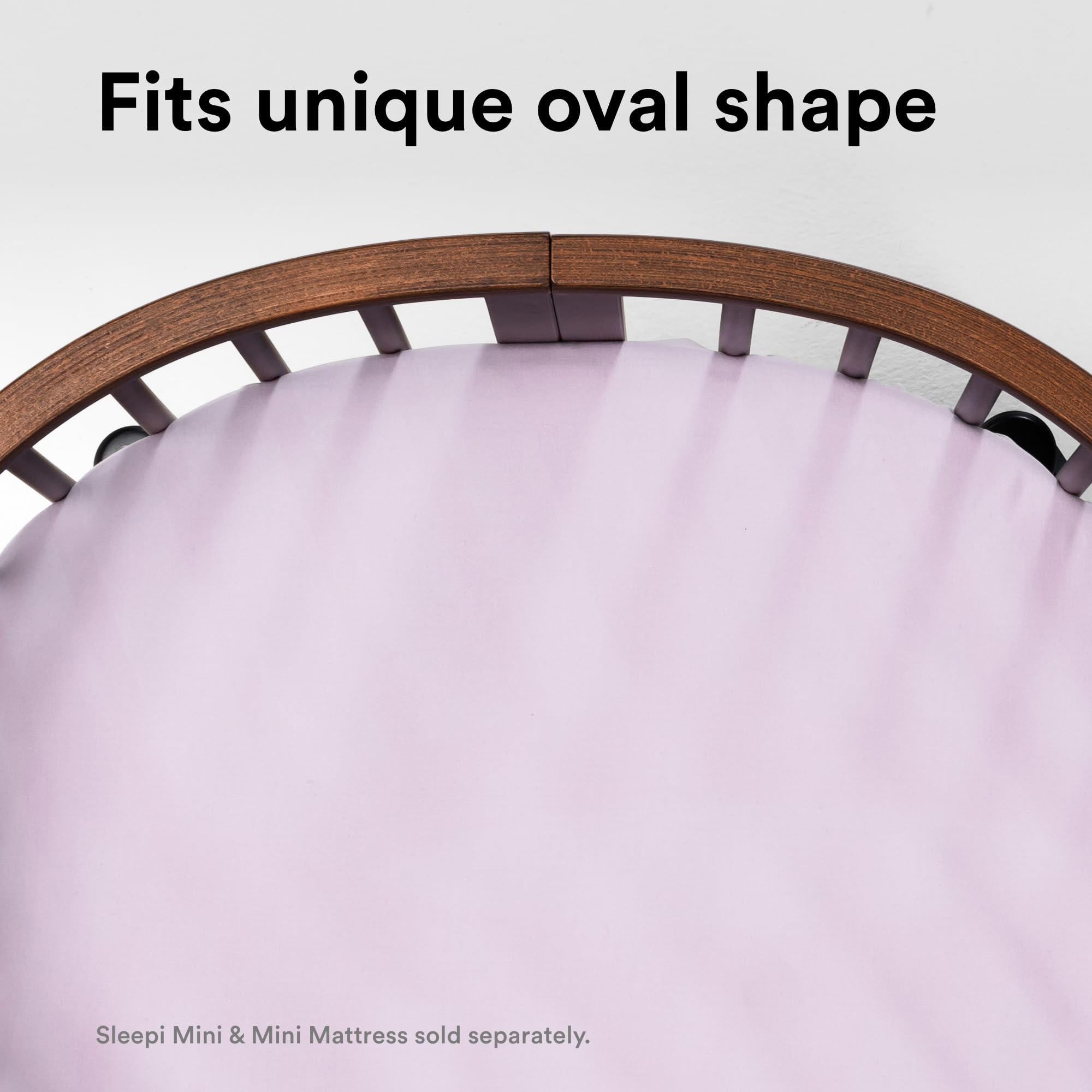 Stokke Sleepi Mini fitted sheet V3 compatibility label demonstrates secure fit.