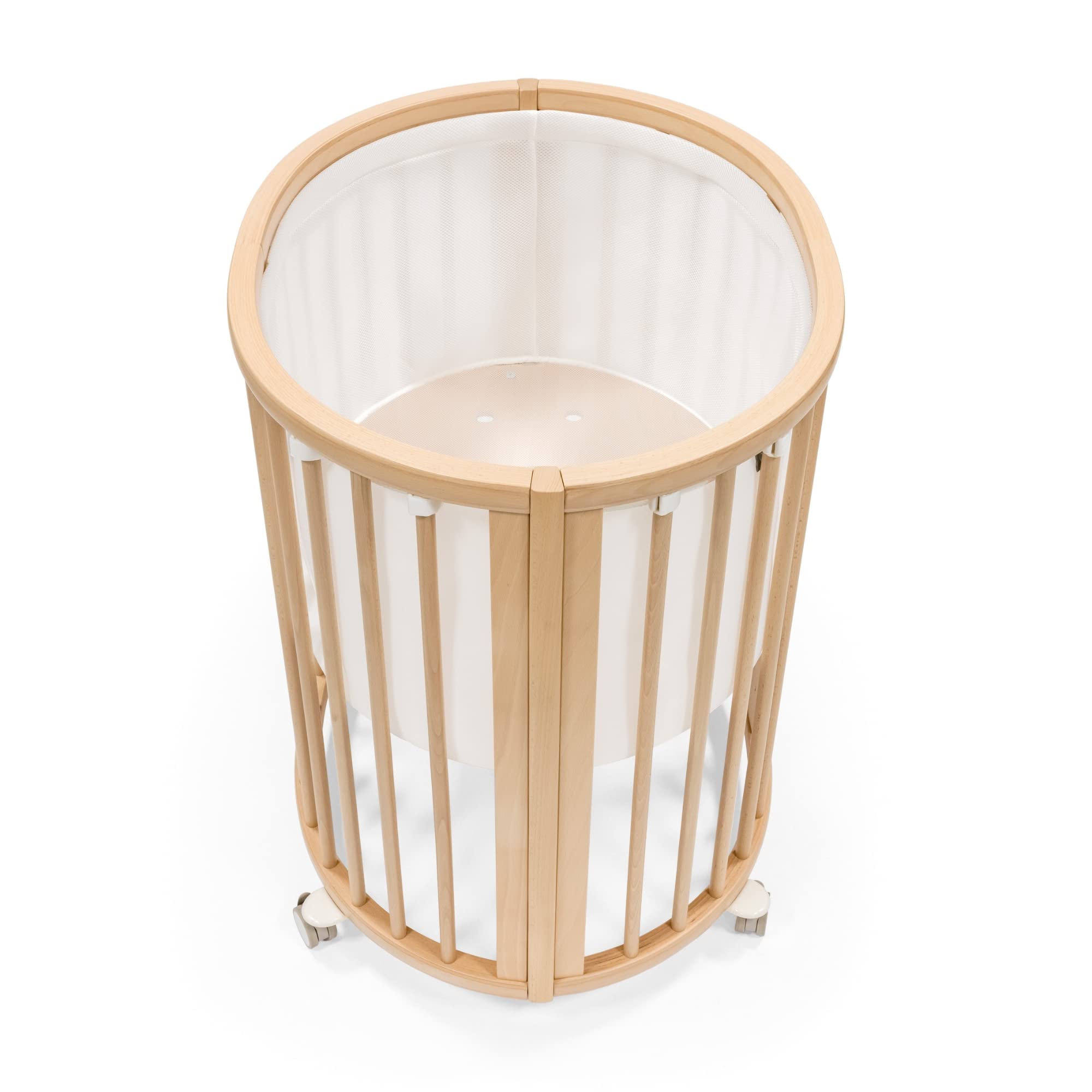 Stokke Sleepi Mini Mesh Liner V3 white closeup showing breathable fabric for safe sleep.