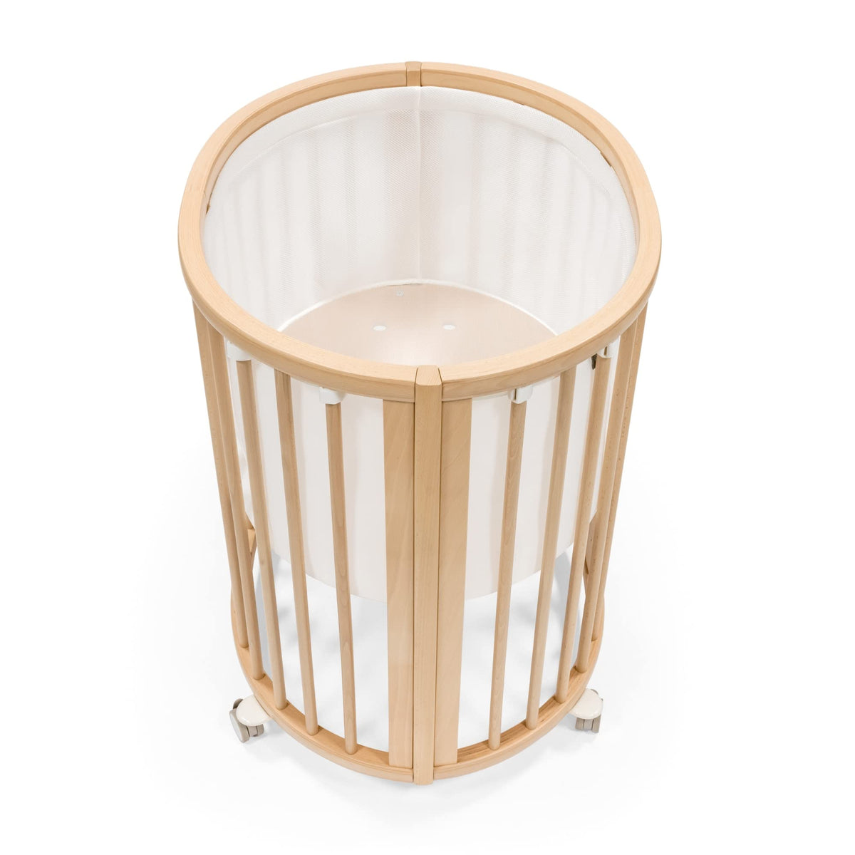 Stokke Sleepi Mini Mesh Liner V3 white closeup showing breathable fabric for safe sleep.