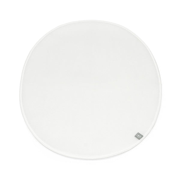 Stokke Sleepi Mini Protection Sheet V3 in white on bed, keeping the sleep surface clean.