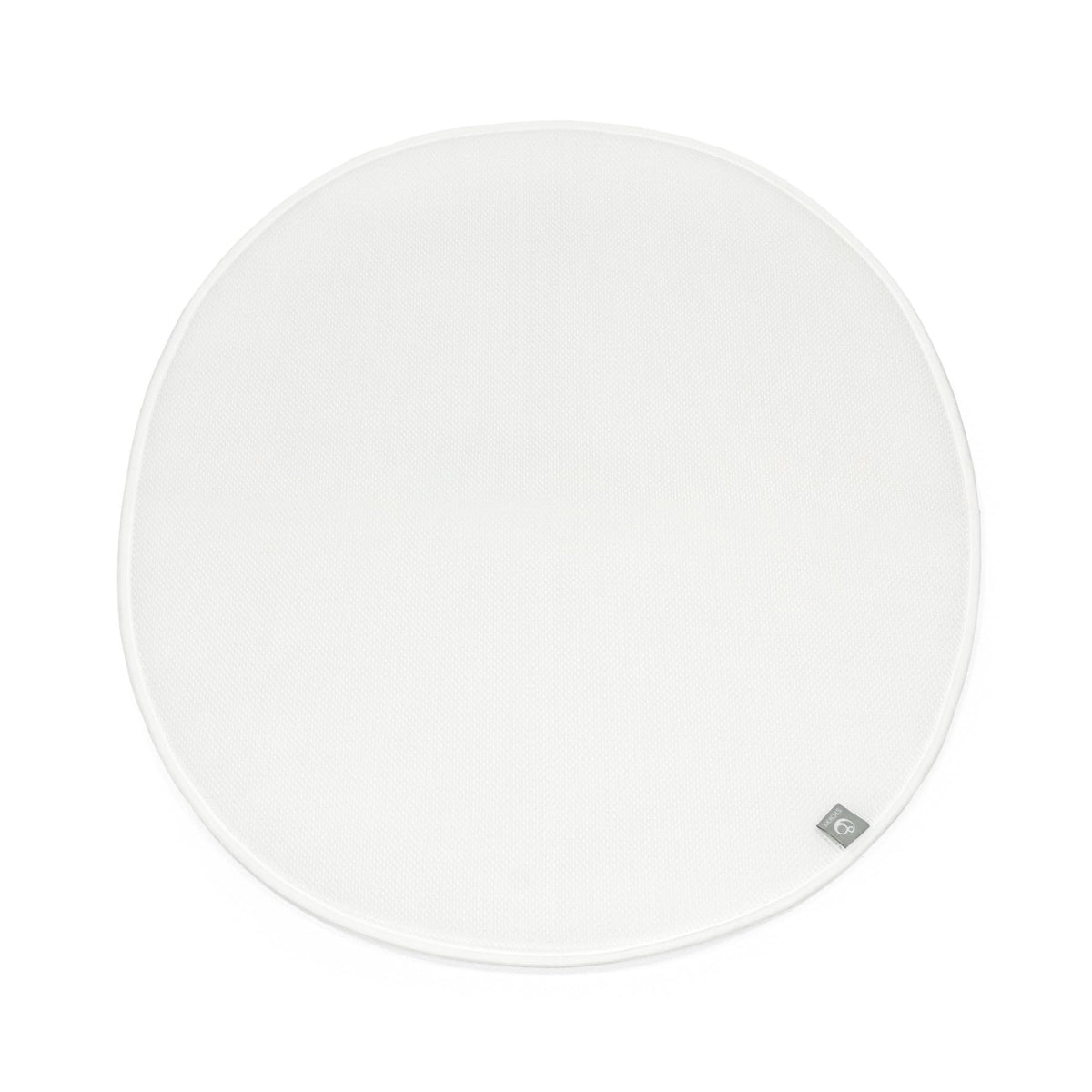 Stokke Sleepi Mini Protection Sheet V3 in white on bed, keeping the sleep surface clean.