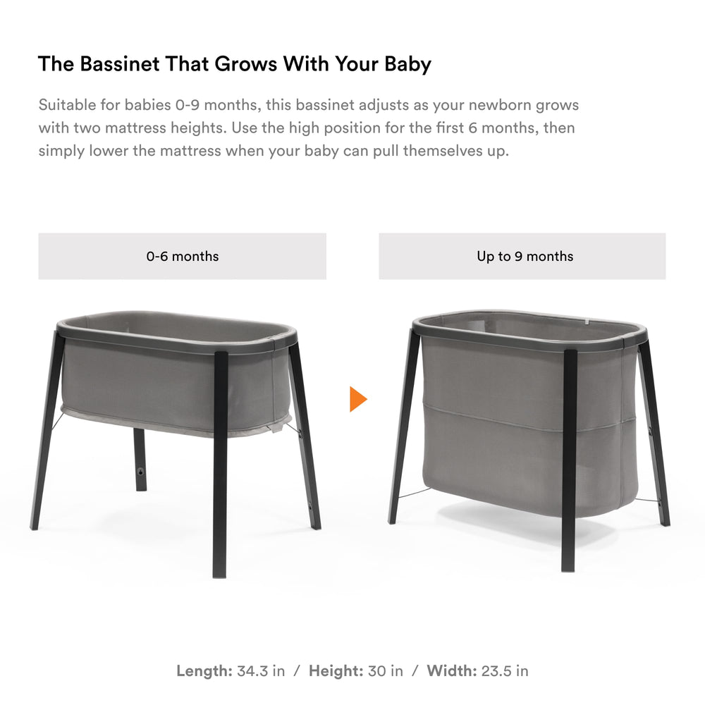 Stokke Snoozi Bassinet Graphite Grey two-height mattress adjustment in use.
