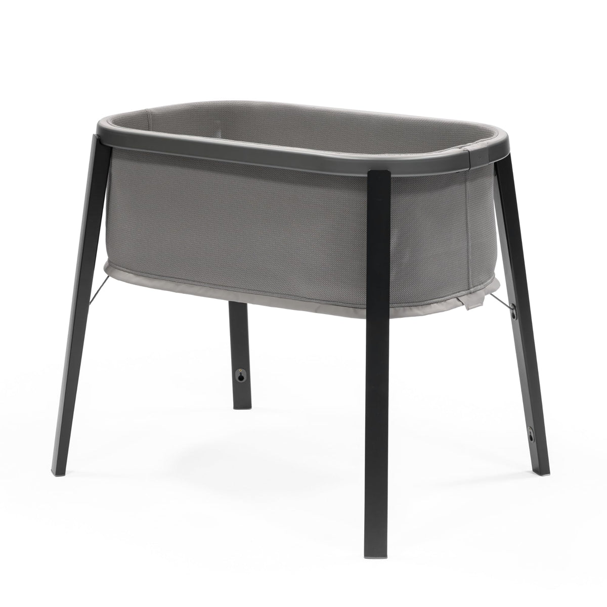 Stokke Snoozi Bassinet Graphite Grey profile view showing safe sleep surface.