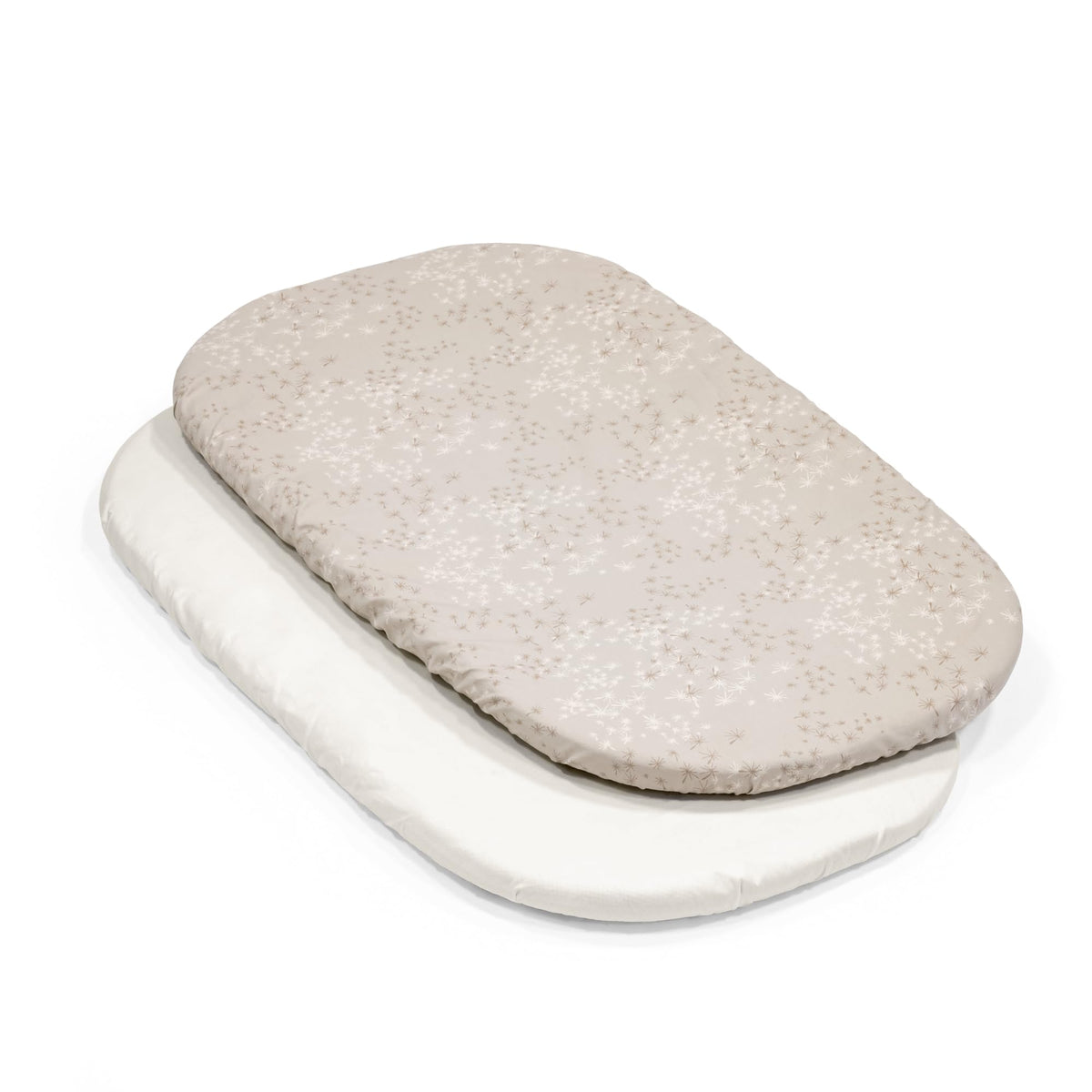 Stokke Snoozi fitted sheet on oval mattress with wraparound zipper for secure fit