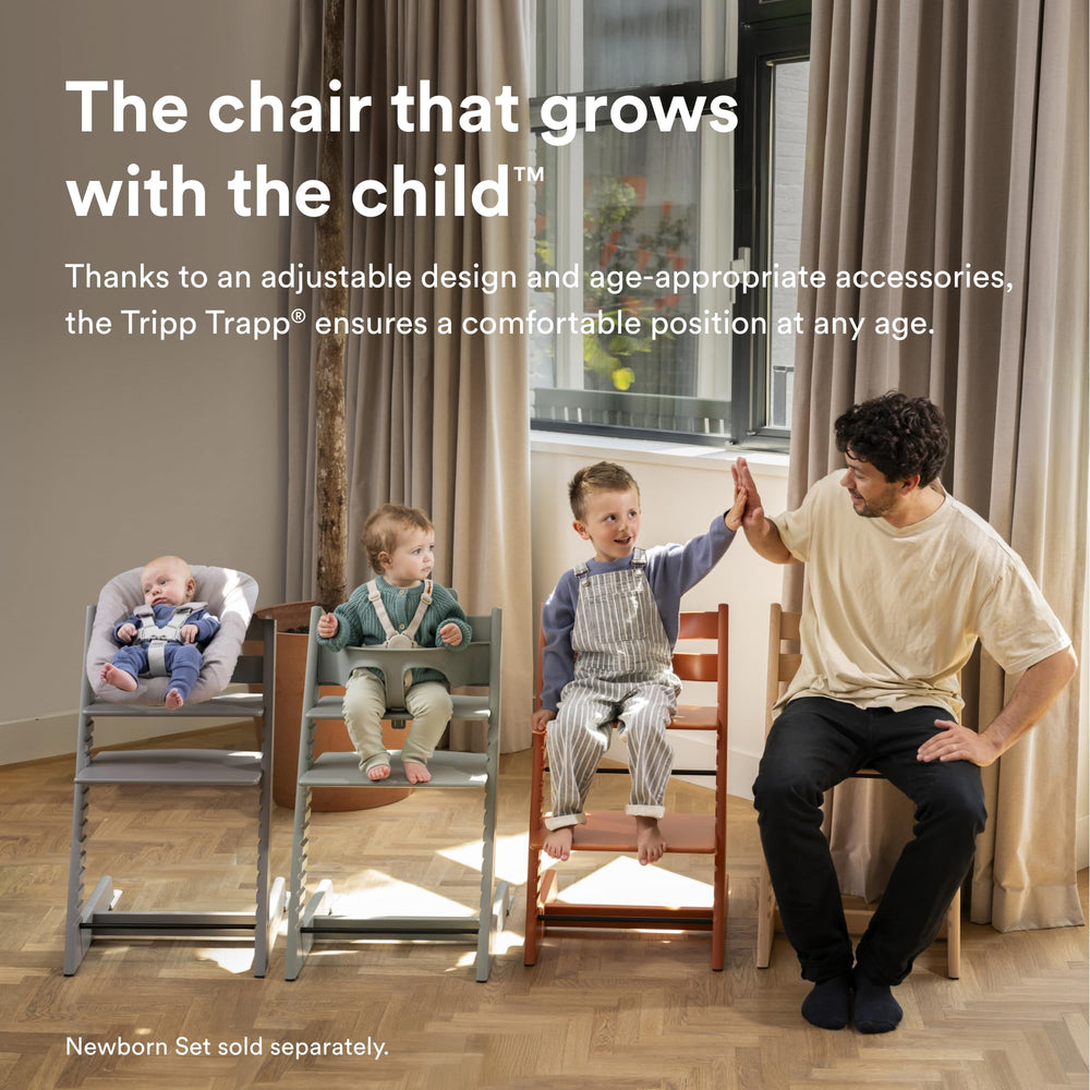Stokke Tripp Trapp baby set 2 Nordic Grey attachment in action for ages 6-36 months