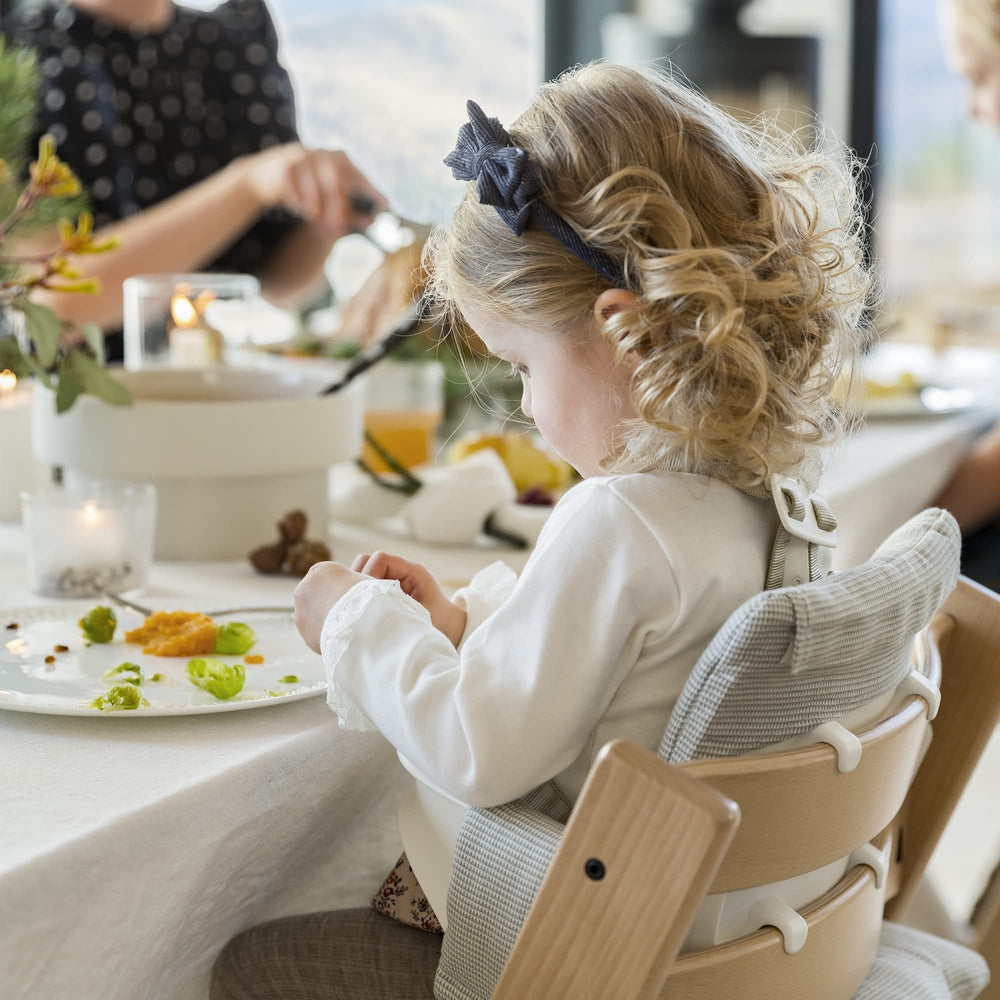 Stokke Tripp Trapp cushion Nordic Grey in use at table during meals