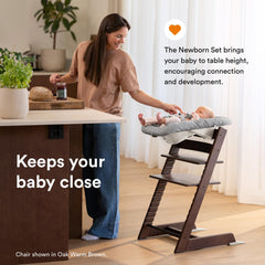 Stokke Tripp Trapp newborn set grey attached securely for early seating.