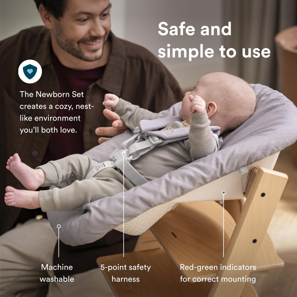 Newborn set grey harness keeps infant secure during mealtimes.