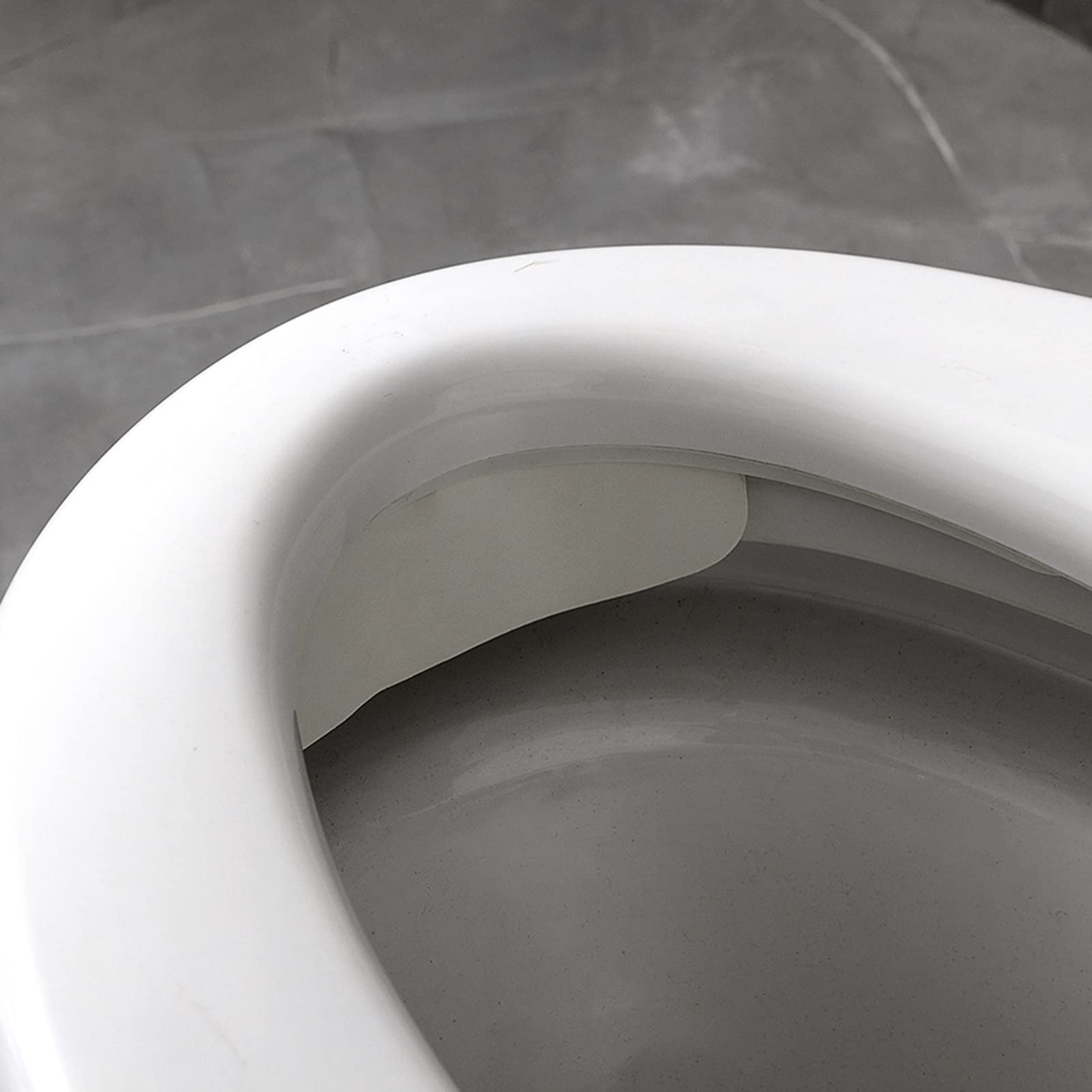 Storchenbeck Urine Deflector universal fit adapts to most seats.