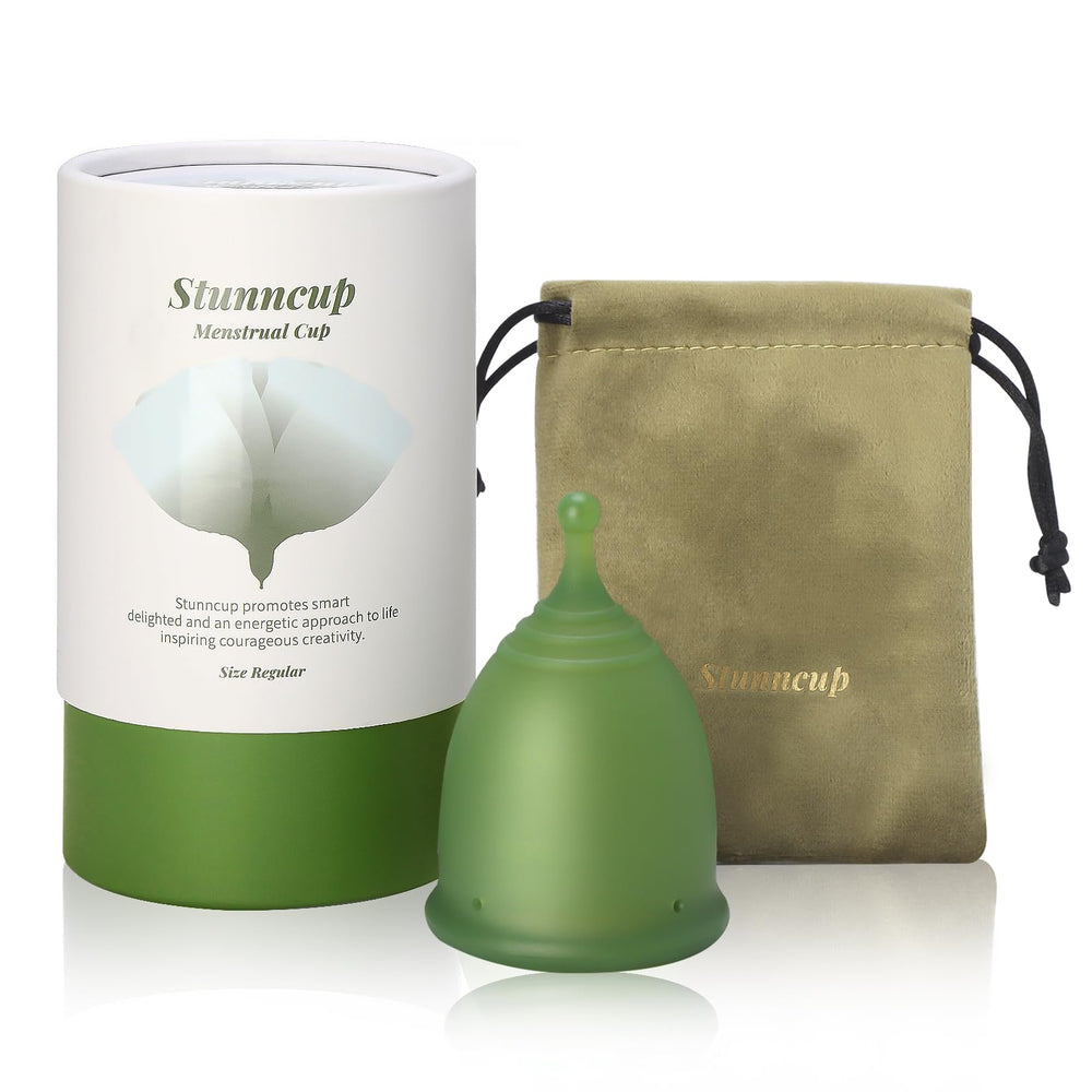 Stunncup soft menstrual cup green close-up, BPA-free comfort for all-day wear.