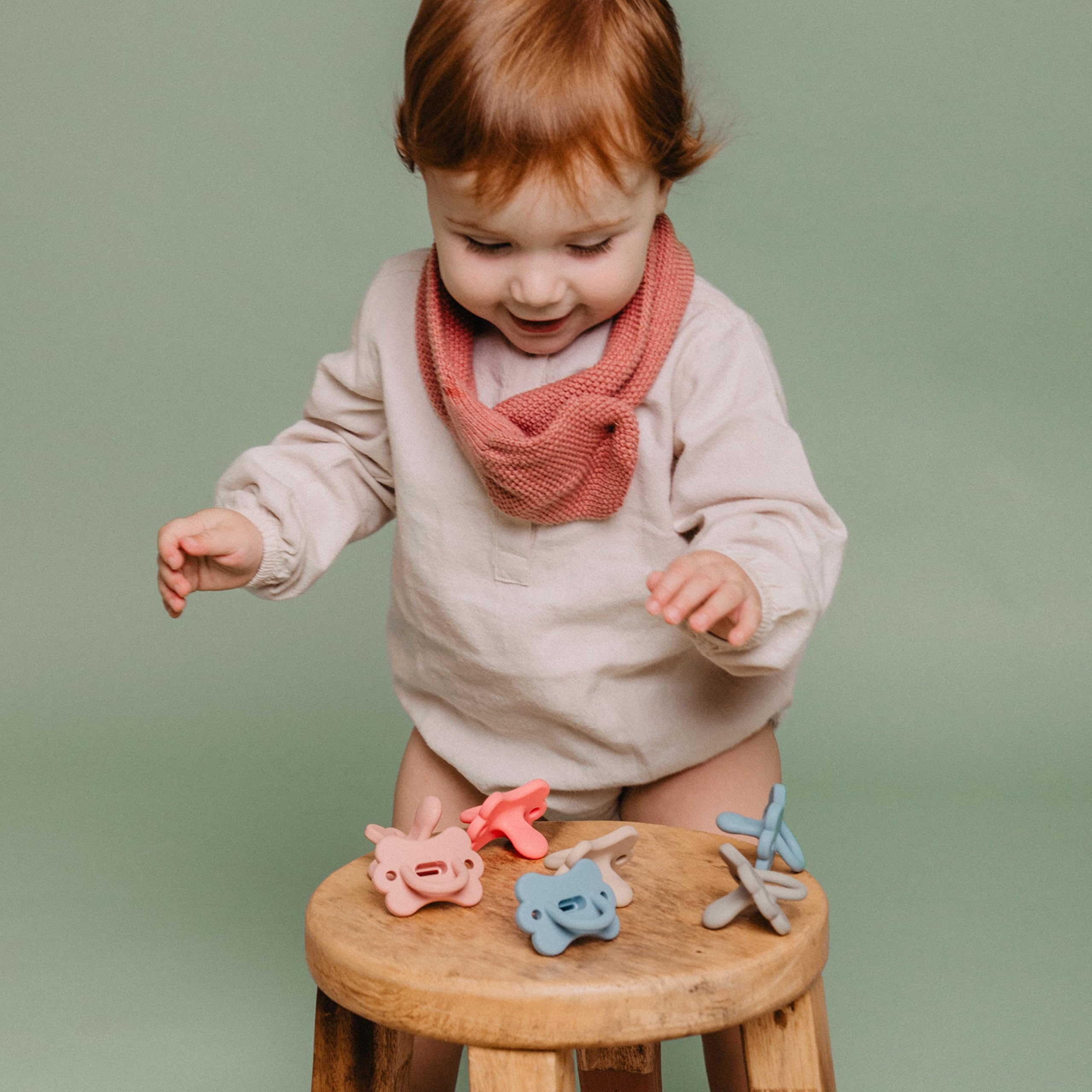 Holder capable of fitting two pacifiers for organized travel.