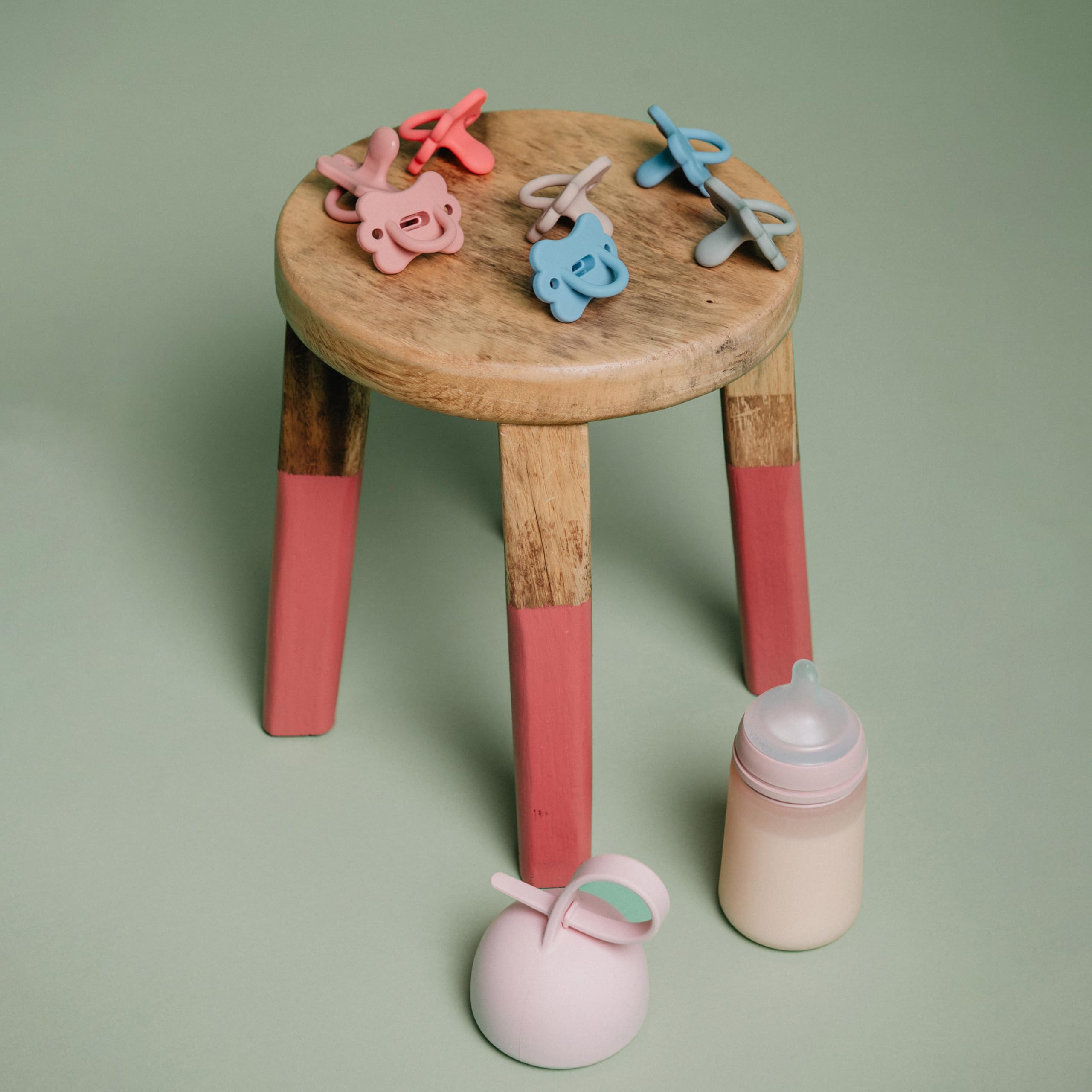 Compact blue pacifier holder keeps pacifiers clean and accessible.