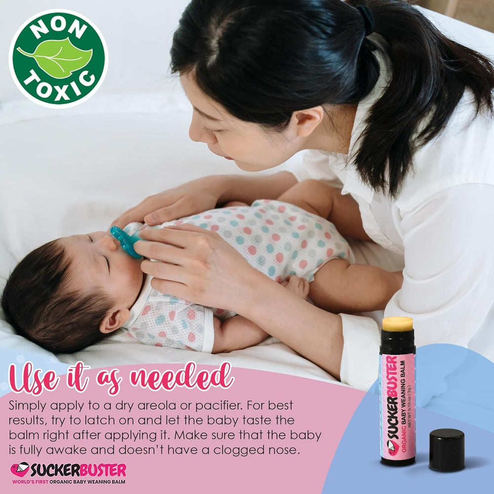 User holding balm stick during baby feeding transition