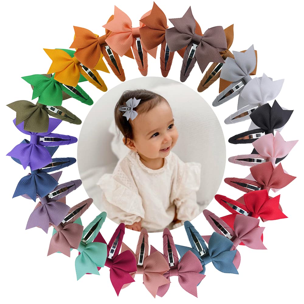 Sugarmelon boutique-style bow closeup on a tiny clip, crafted for delicate baby hair.