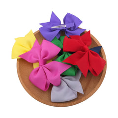 Sugarmelon swallow-tail bow clip close-up shows handmade grosgrain ribbon for a refined look.