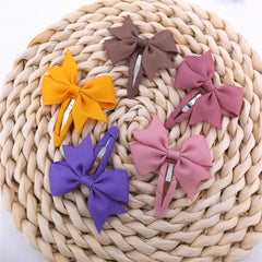 Sugarmelon tiny 42mm bow in hair demonstrating gentle hold for fine hair.