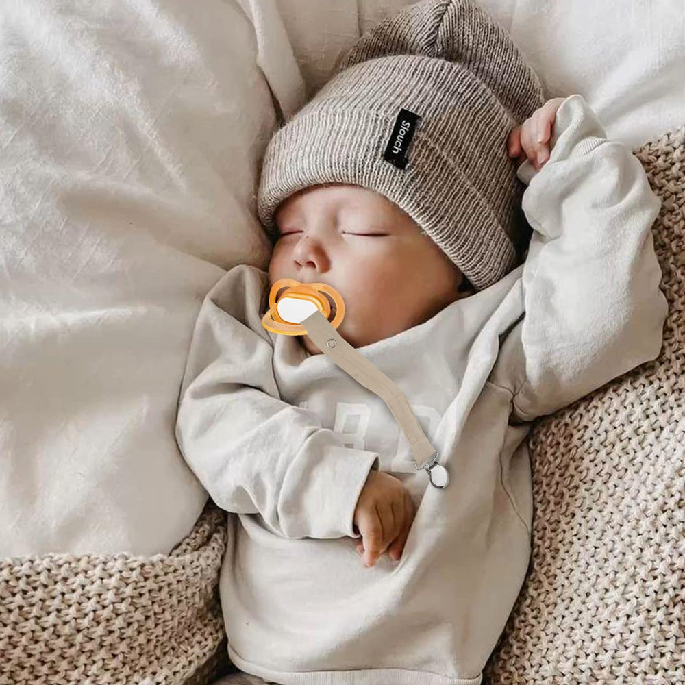 Sugee four-pack pacifier clips in neutral colors for versatile styling.