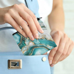 SUITOSELFY teal marble period bag side zipper close-up for secure containment