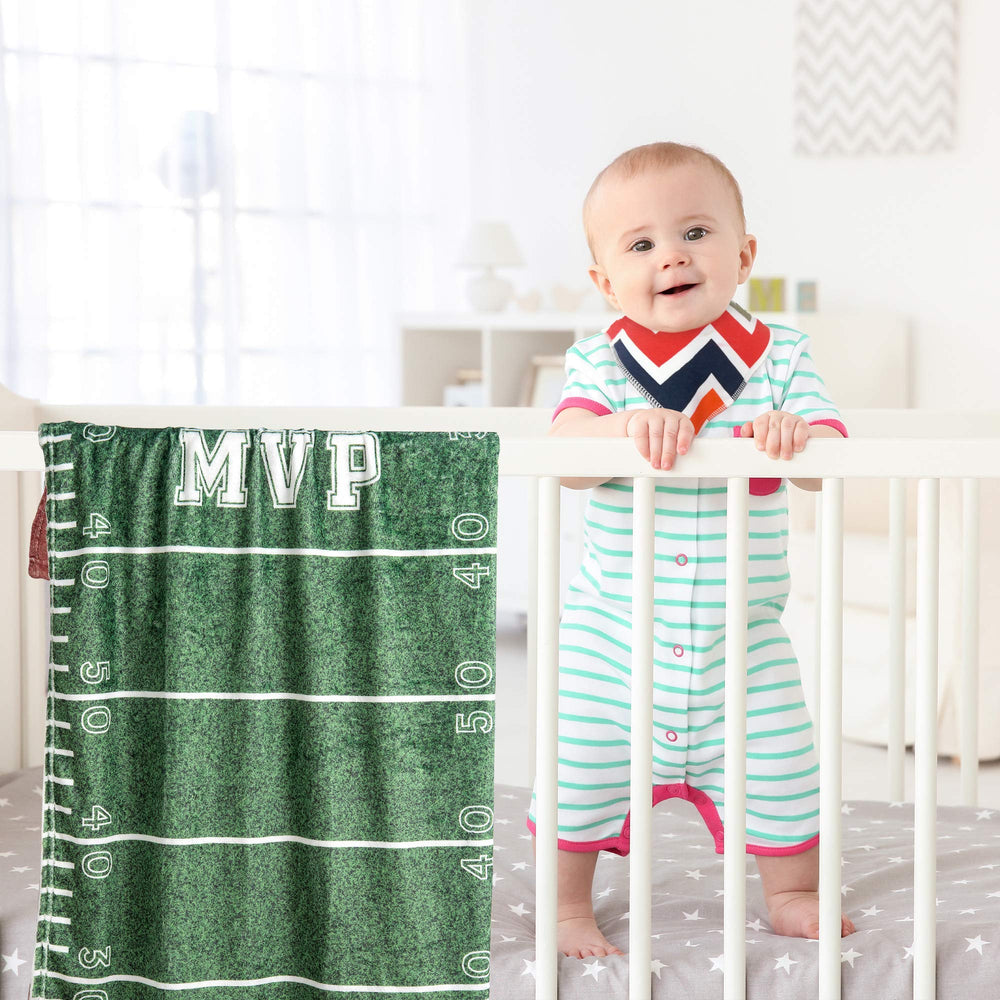 SUKOON Football Milestone Blanket baby photo setup in a cozy layout