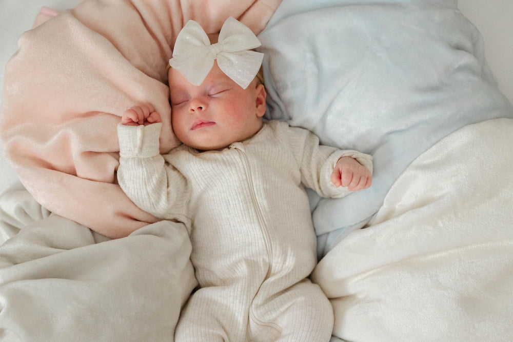 Sunshine and Snuggles cloud blue blanket adds stylish nursery decor.