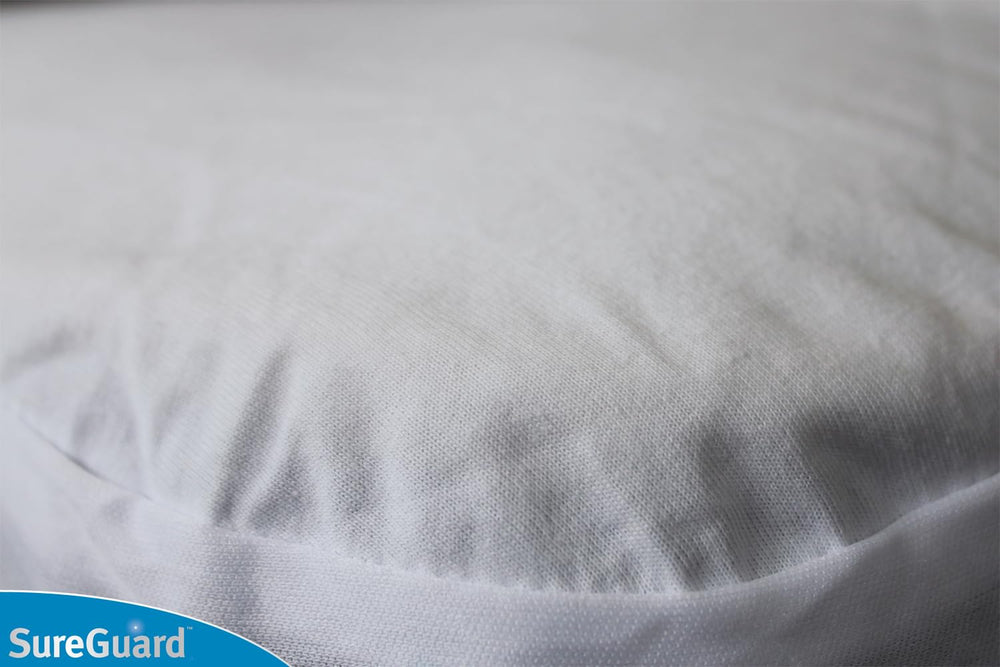 SureGuard top-side barrier blocks dust and allergens for a cleaner crib
