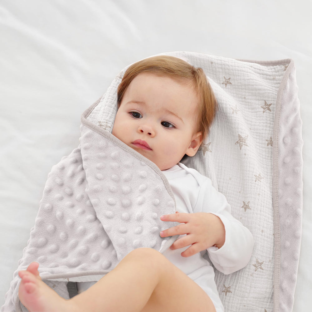 Susurration baby blanket doubles as stroller cover on the go
