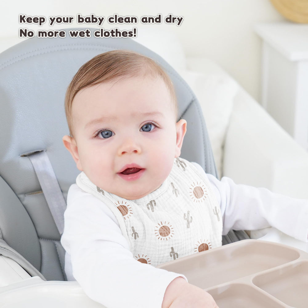 Susurration Dinosaurs Park baby wearing bib showcases unisex design for outfits.