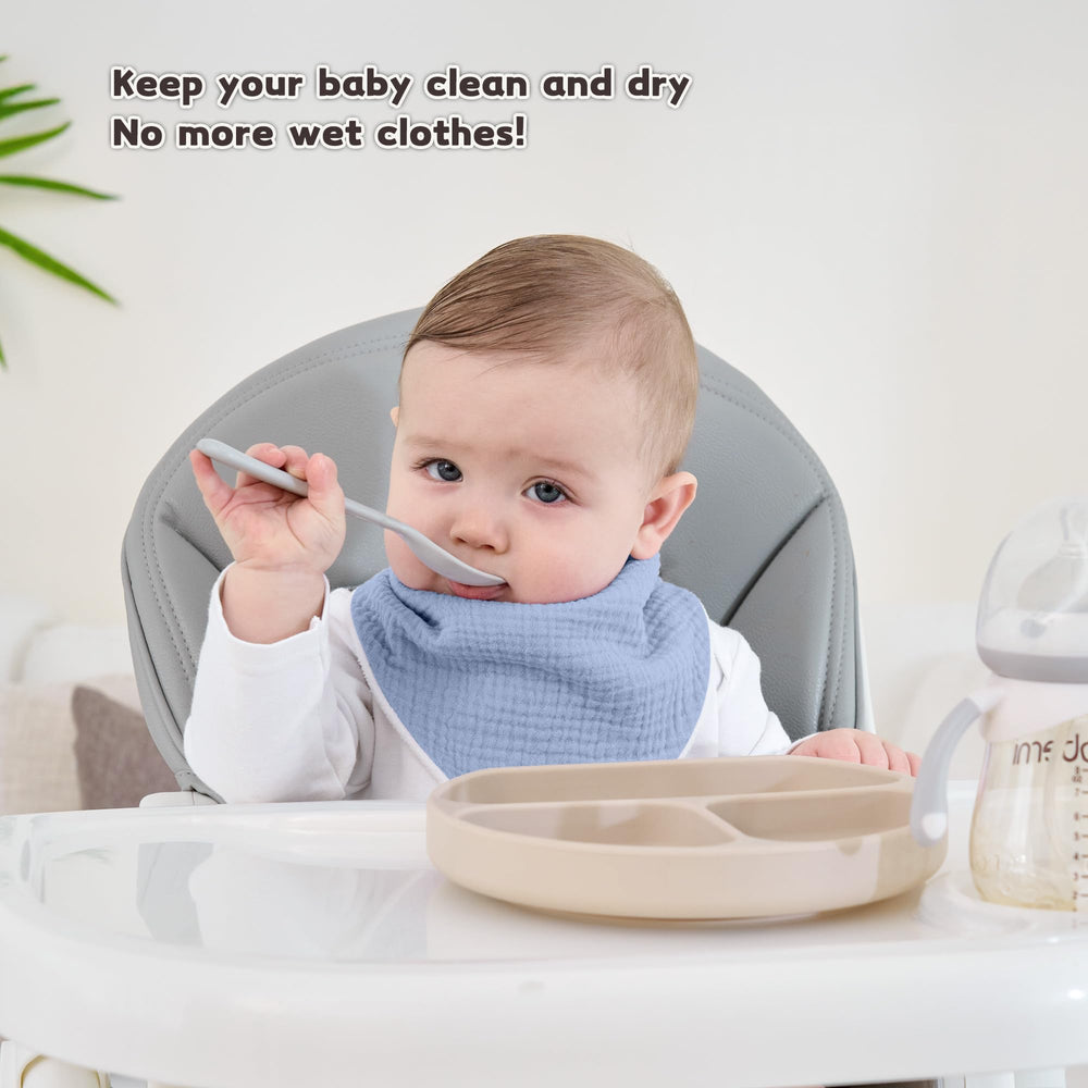 Susurration Muslin Bibs worn on baby demonstrate drool protection and comfort.
