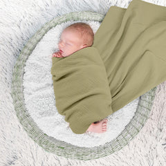 Susurration blanket wrapped around baby for secure swaddling and sleep-like calm.