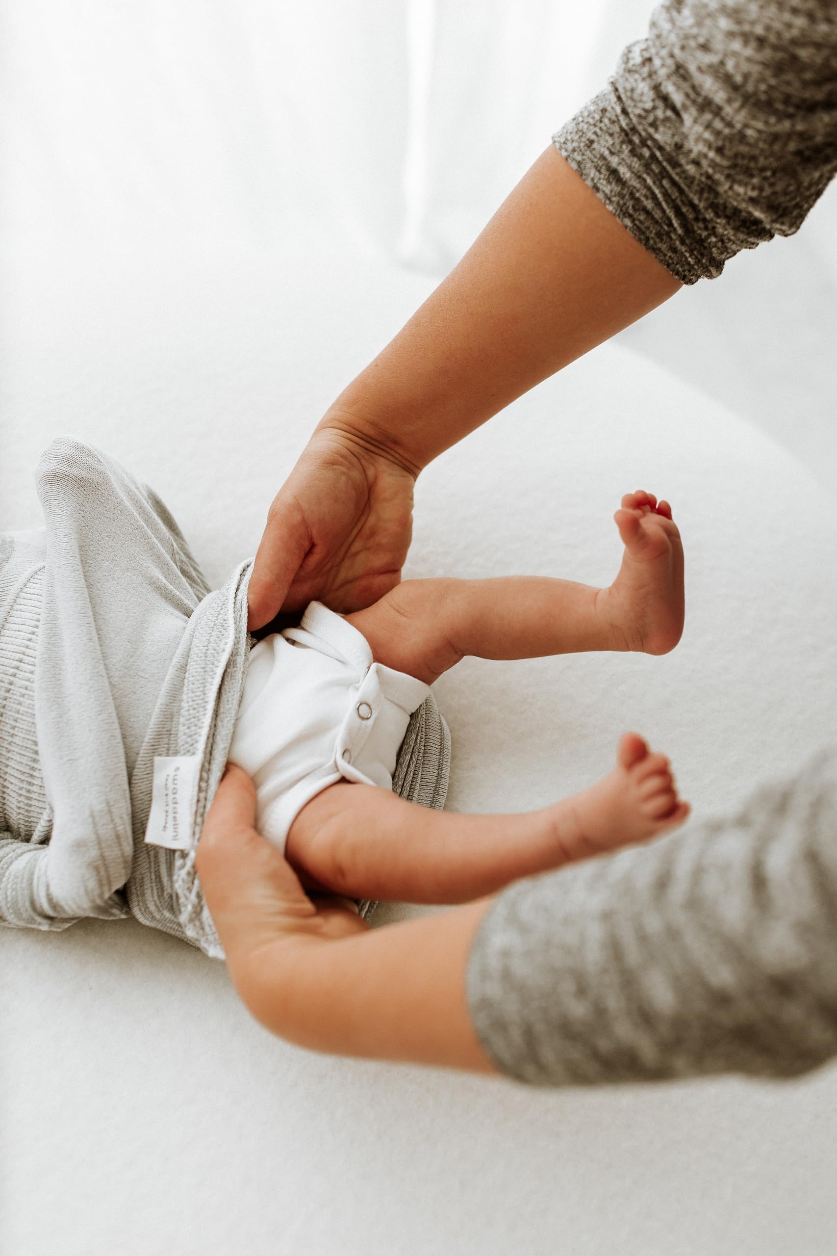 Swaddelini grey swaddle sleep sack size 6-12 lb for newborns.