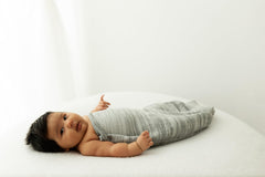Swaddelini hug technology softly cradling baby to support self-soothing.
