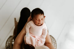 Swaddelini Swaddle Sleep Sack Pink packaging showcases USA-made eco-friendly manufacturing.