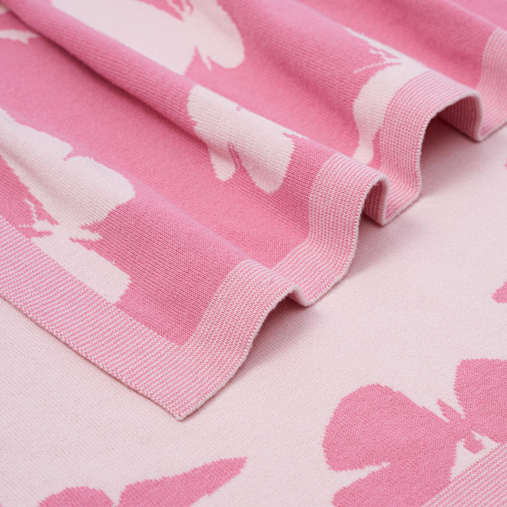 SWaddle AN two-sided butterfly design for reversible nursery styling.