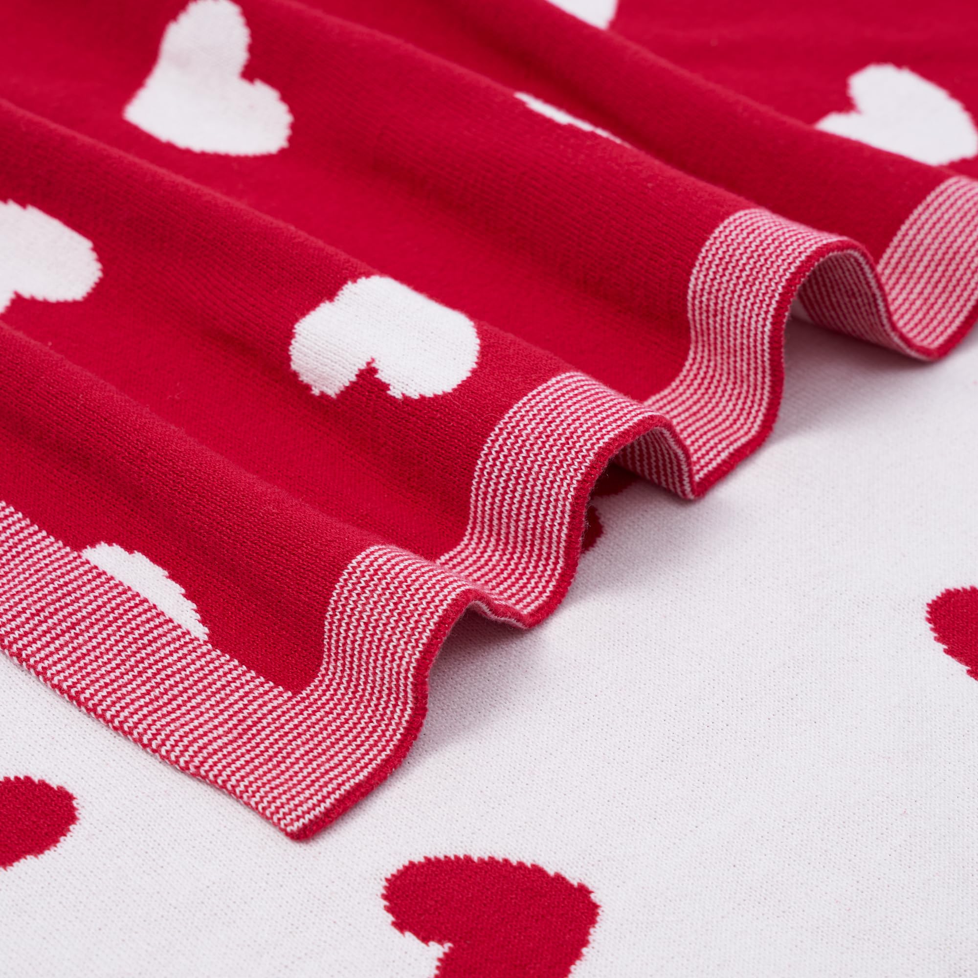 SWaddle AN Valentine heart pattern blanket highlights charming design for everyday naps.