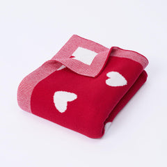 SWaddle AN Valentine two-sided heart blanket shows reversible design for cozy baby snuggles.