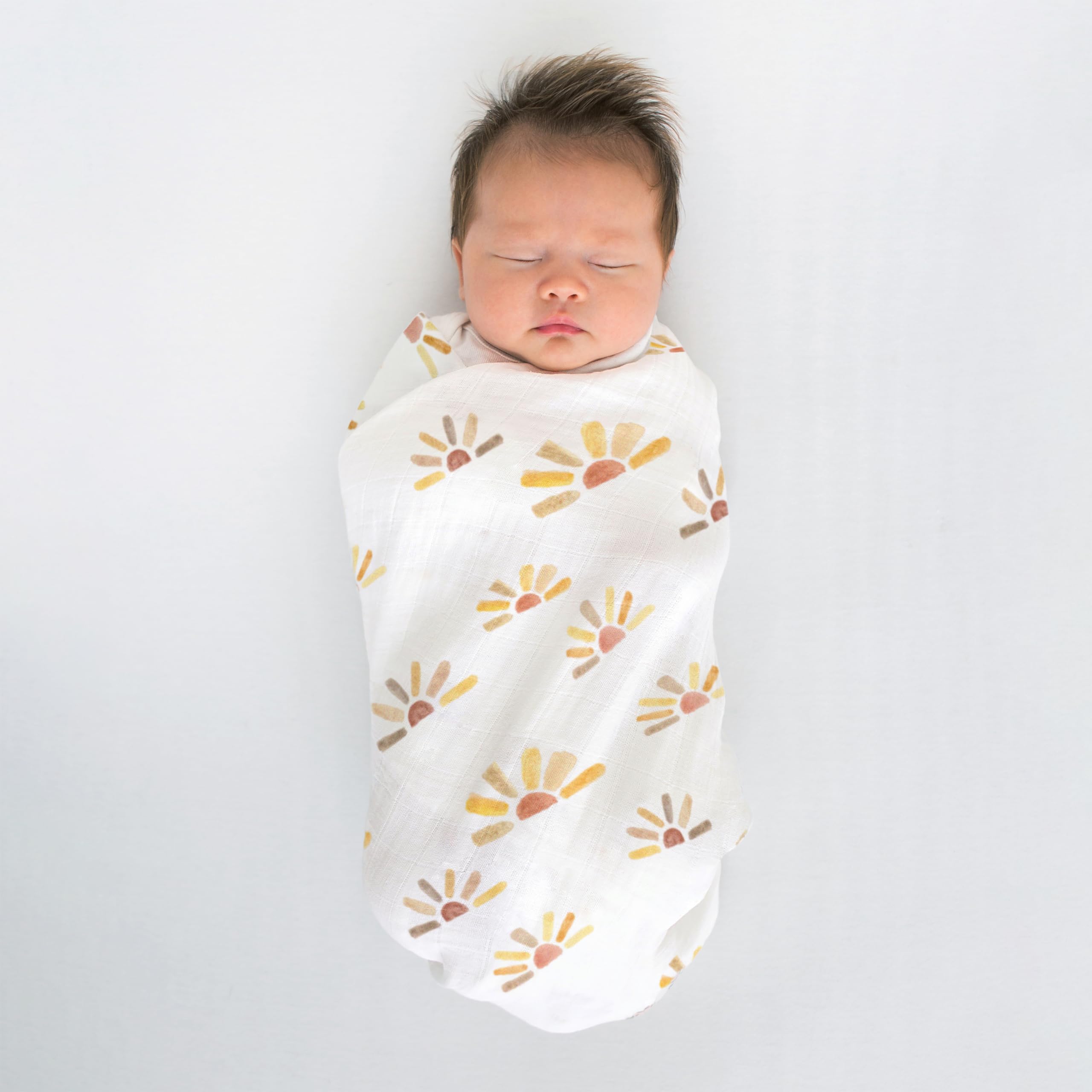 SwaddleDesigns machine washable muslin blanket shown in practical use