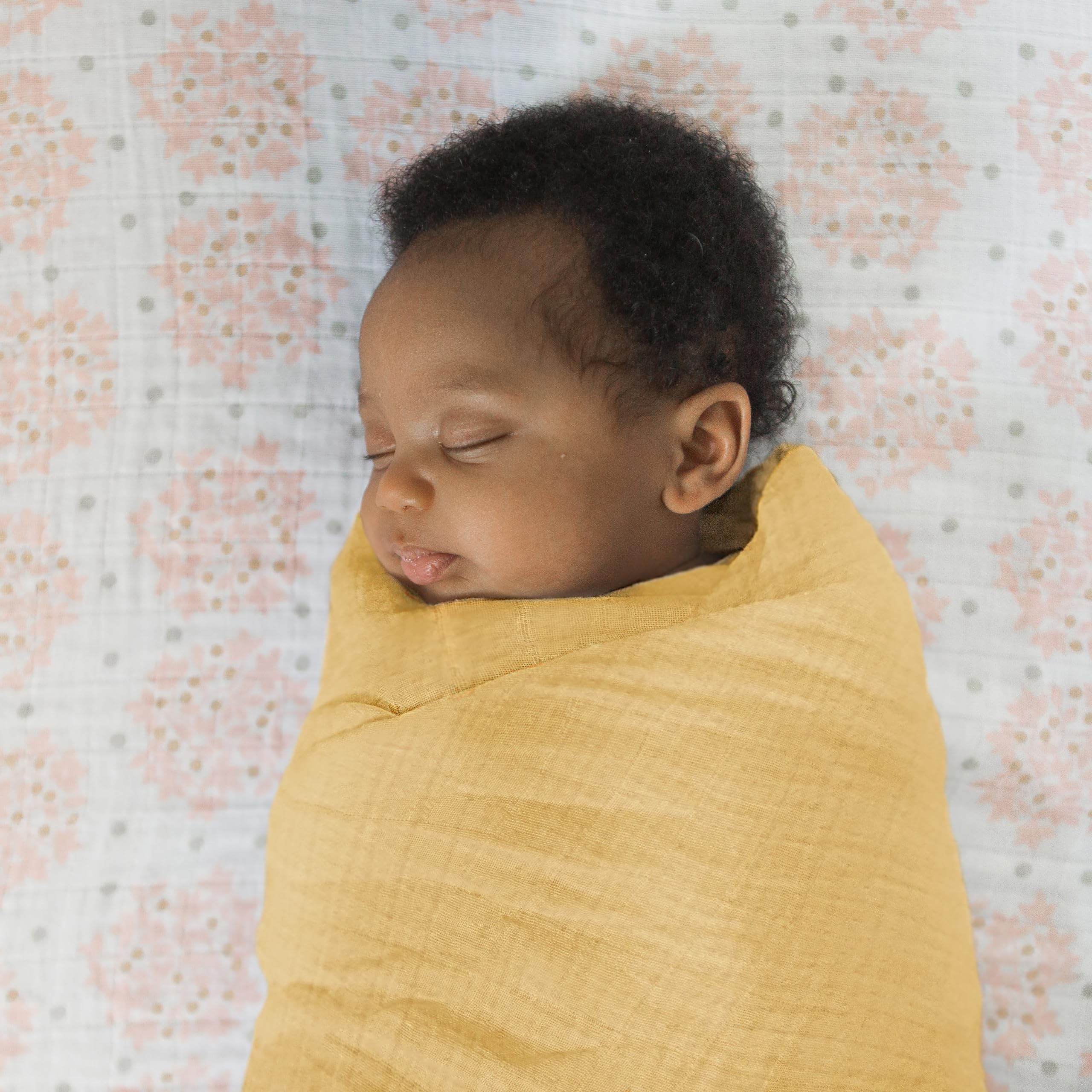 SwaddleDesigns privacy throw being used during feeding in a calm setting