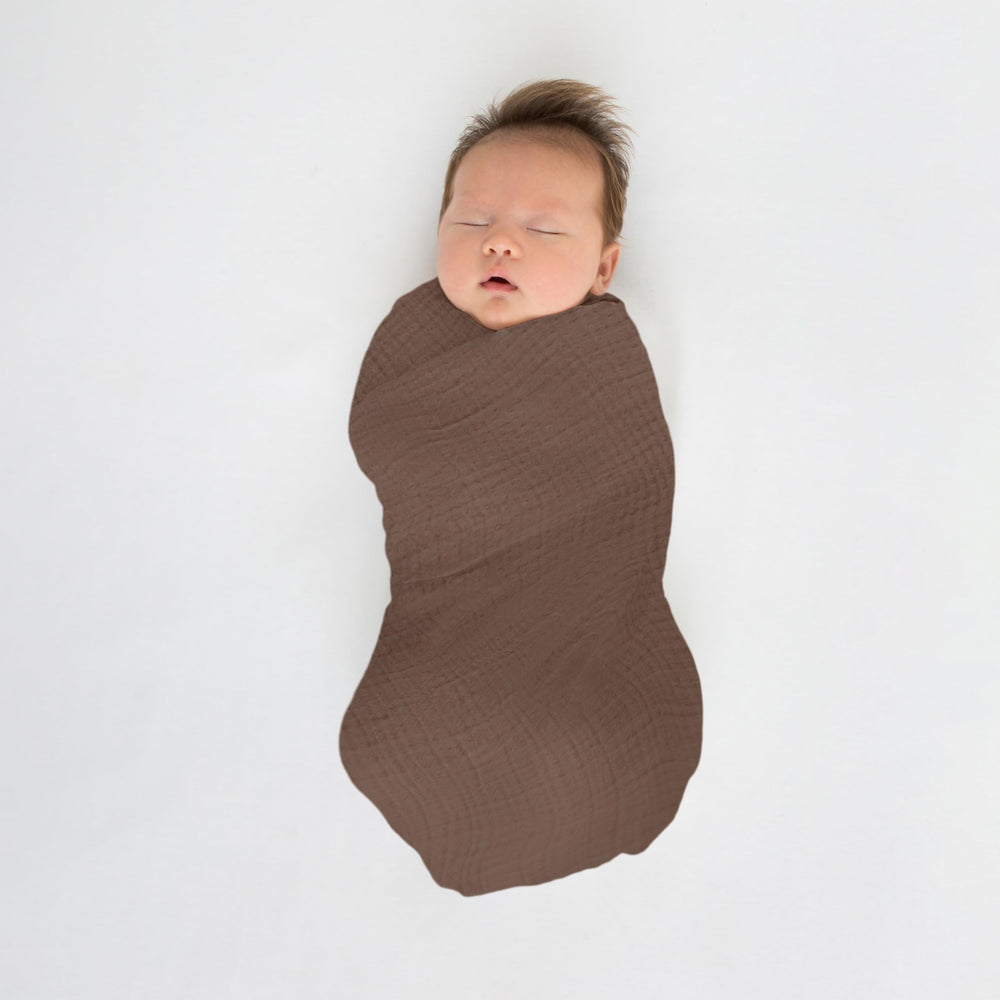 SwaddleDesigns outdoor-ready sunshield-like blanket on stroller outing