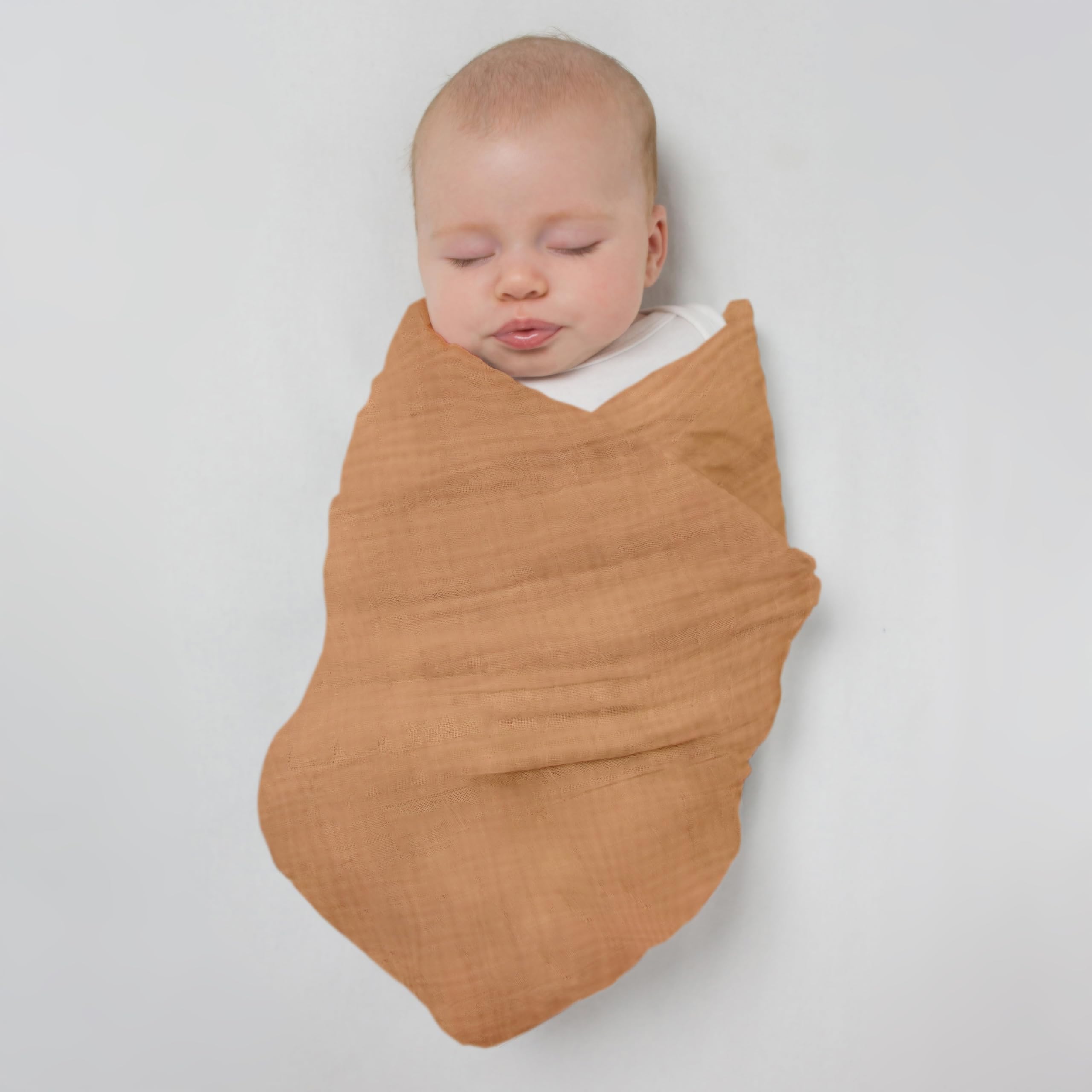 SwaddleDesigns tummy time friendly blanket laid on play mat