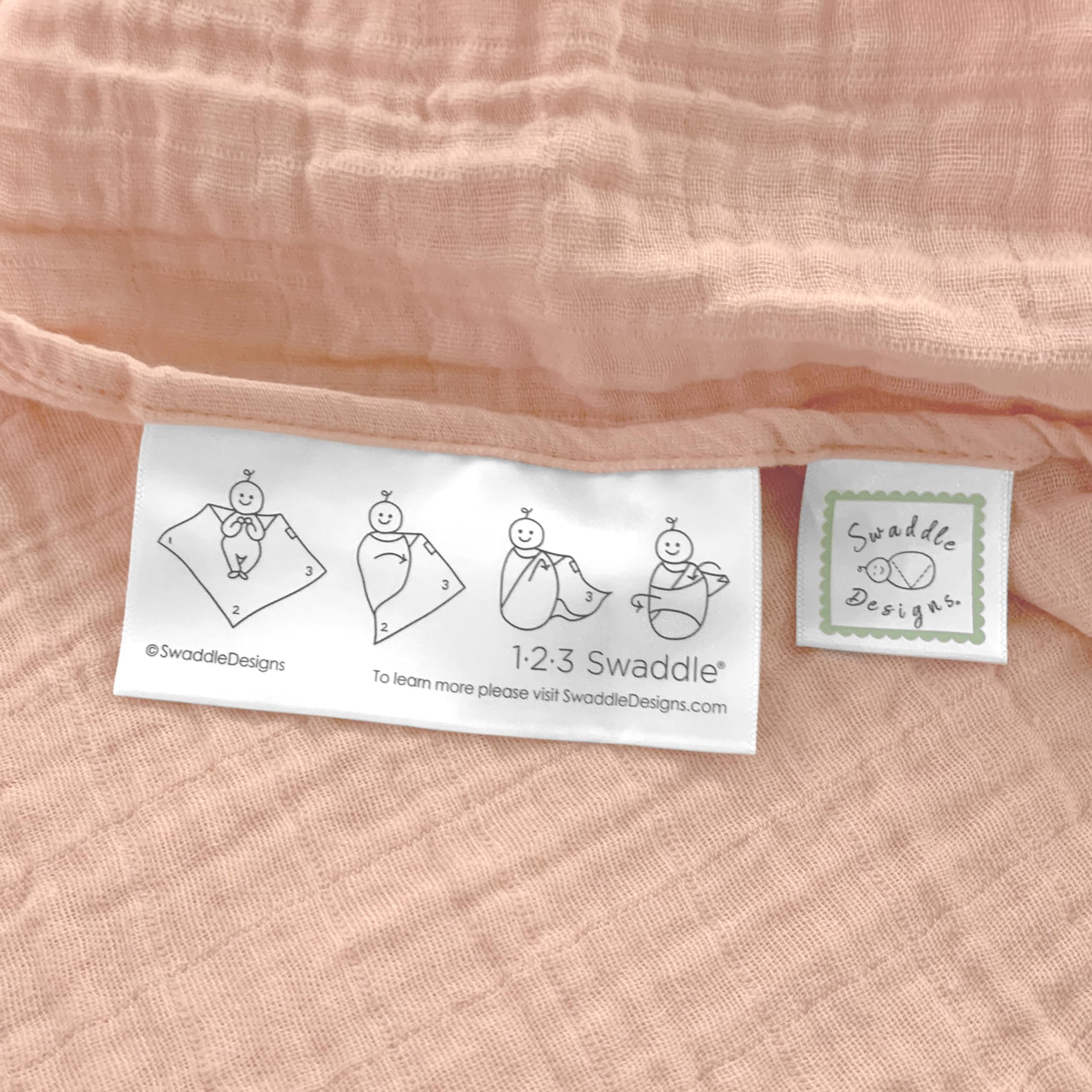 SwaddleDesigns blanket edge features 123 swaddle label for easy use.