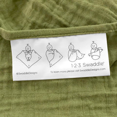 SwaddleDesigns blanket edge shows 123 Swaddle label with easy swaddling steps.