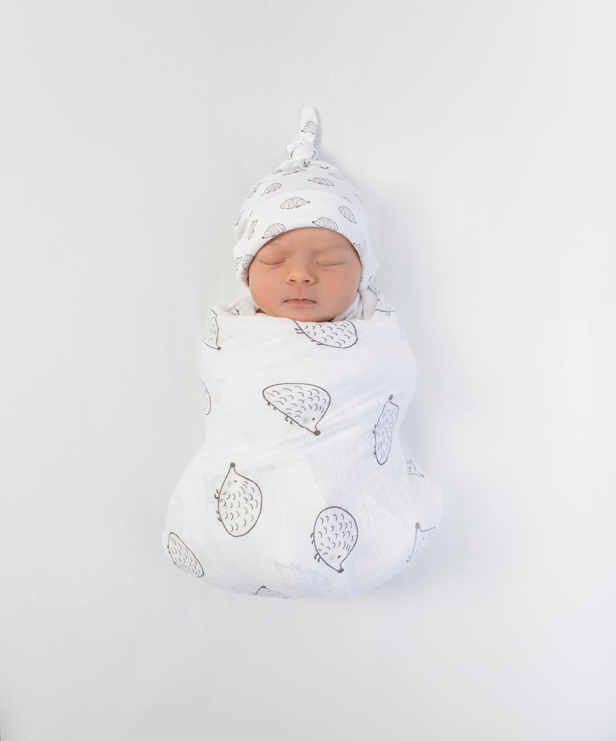 Nursery-shot with SwaddleDesigns blanket demonstrating versatile cozy accessory