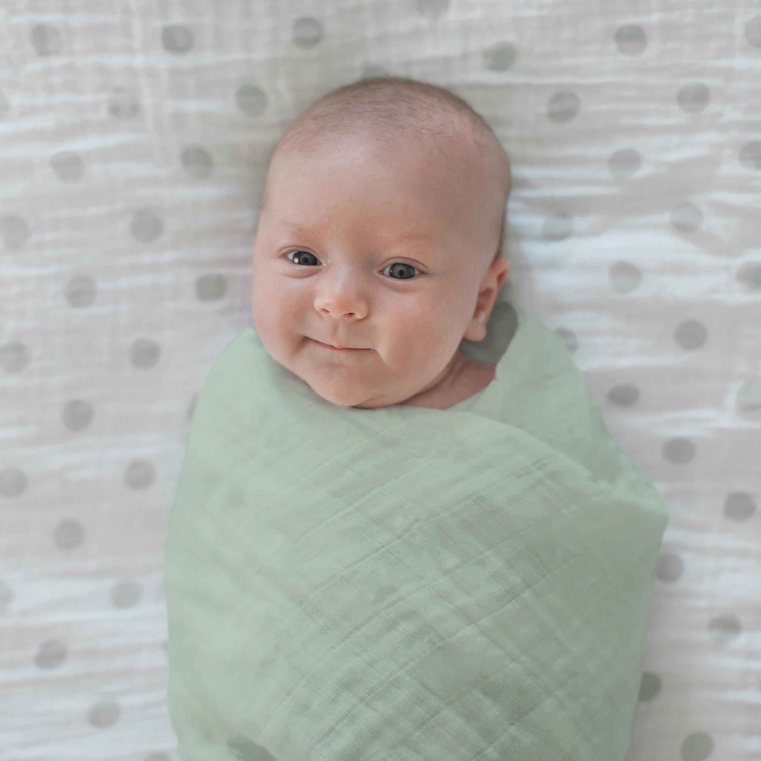 Baby wrapped in Jadeite swaddle during a nap for comfort and security.
